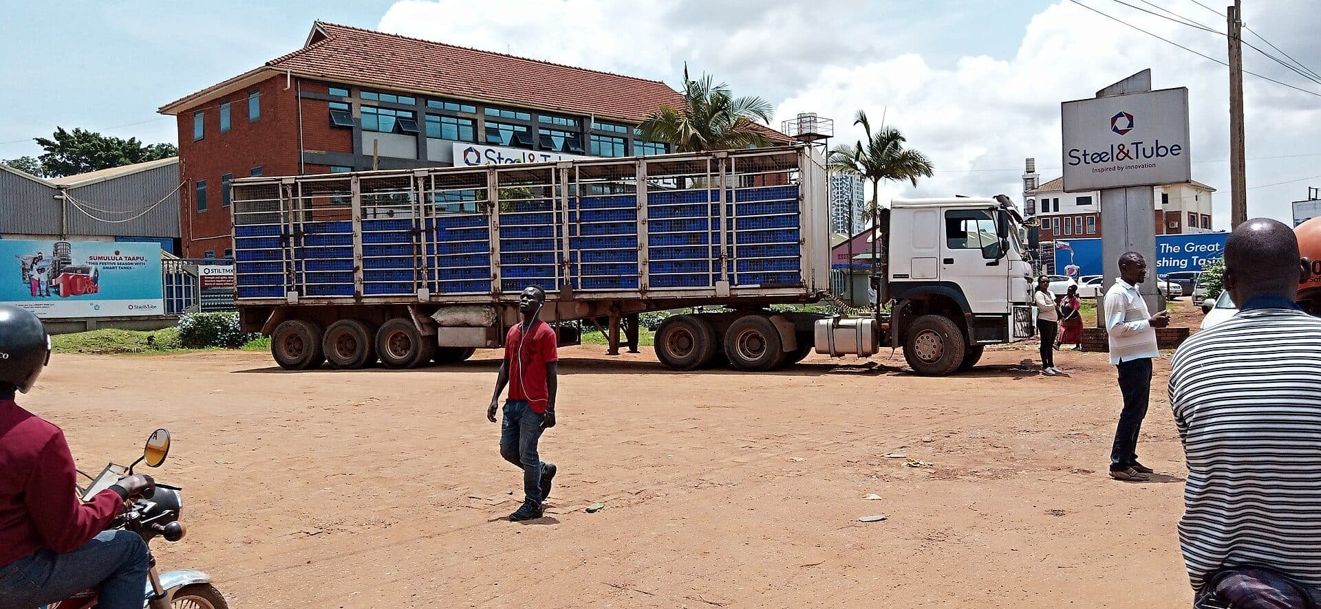 Delivery truck loaded with crates in a Ugandan town